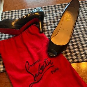 Christian Louboutin black, open toed, leather pumps with storage bag